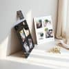 O1CN0132Yufx2Hf7lxrJXkt_2209056409177-0-cib.jpg Modern photo display boards with artwork and decorative leaves on a bright windowsill, showcasing creative interior decor.