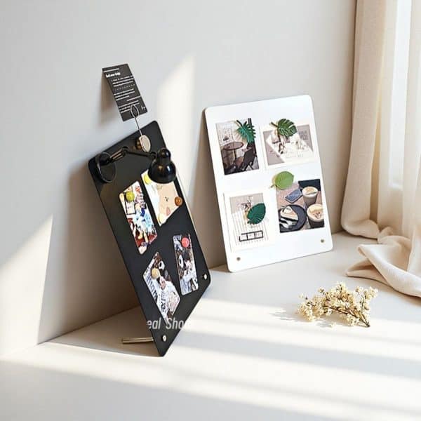 O1CN0132Yufx2Hf7lxrJXkt_2209056409177-0-cib.jpg Modern photo display boards with artwork and decorative leaves on a bright windowsill, showcasing creative interior decor.