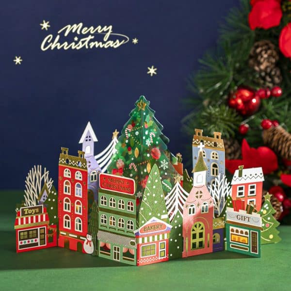 O1CN01CDOmky1LmgPM7E1Jx_2620801342-0-cib.jpg Colorful 3D Christmas village paper craft with festive buildings and a decorated tree in a holiday scene.