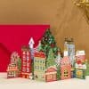 O1CN01Ea2bYU1LmgSkwRc4z_2620801342-0-cib.jpg Colorful 3D Christmas village with decorated trees, gift shops, and festive buildings for holiday decor.