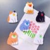 O1CN01UygbM42MK7ZbxA65n_3525089808-0-cib.jpg Colorful cat-shaped magnets on a gray background, perfect for decor and organization.